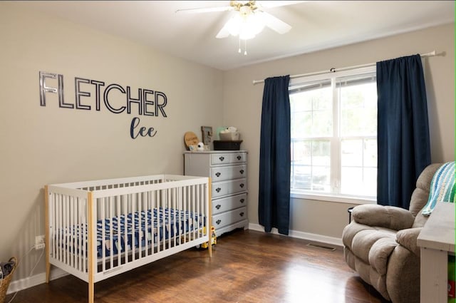 bedroom featuring dark hardwood / wood-style floors and ceiling fan