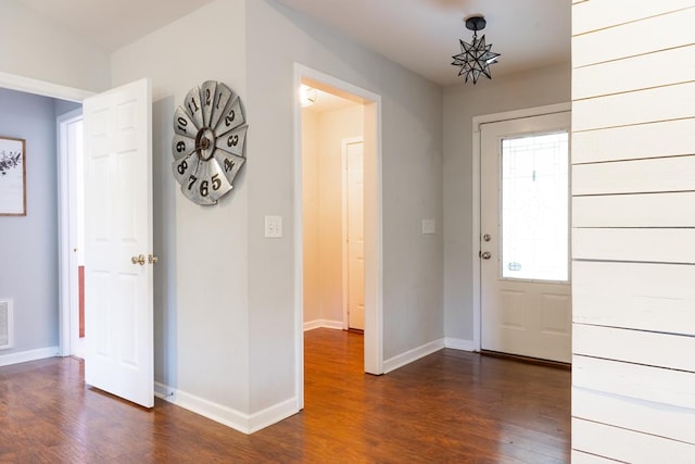 foyer with dark hardwood / wood-style floors