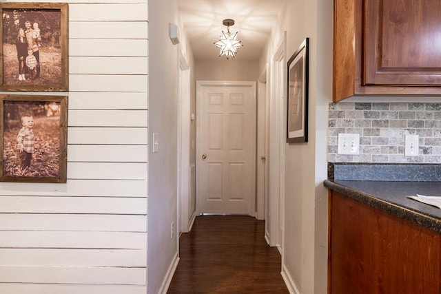 hallway featuring dark hardwood / wood-style floors