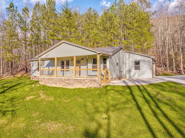 view of front of property with a front yard and covered porch