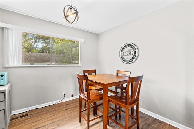 dining space featuring hardwood / wood-style floors