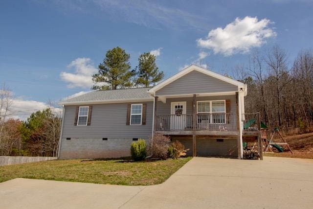 ranch-style house with crawl space, covered porch, a front lawn, and a playground