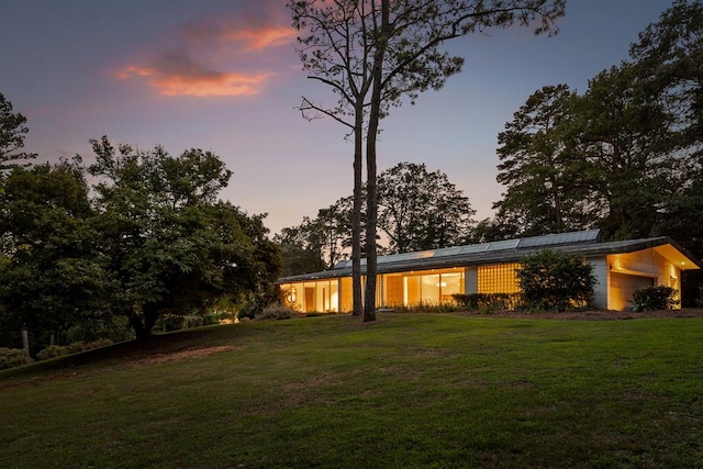 yard at dusk with a garage