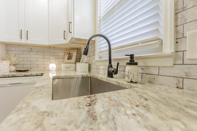 1900 Meadowbrook Cir, Dalton, GA 30720 - kitchen view of a sink, tasteful backsplash, light stone countertops, white cabinets, and dishwasher