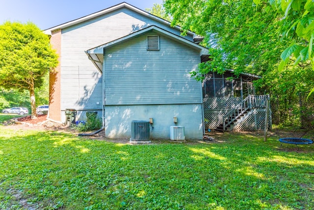 1900 Meadowbrook Cir, Dalton, GA 30720 - back of house with a sunroom, central AC, stairs, and a yard