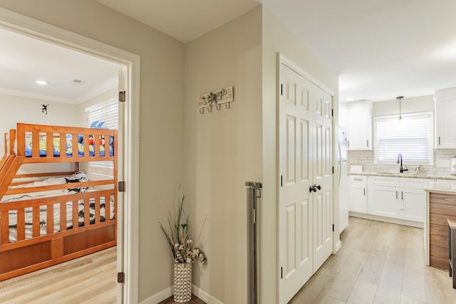 1900 Meadowbrook Cir, Dalton, GA 30720 - hallway featuring a sink, light wood-style floors, ornamental molding, and recessed lighting