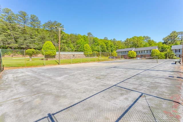 1900 Meadowbrook Cir, Dalton, GA 30720 - view of patio featuring a tennis court, fence, and a wooded view
