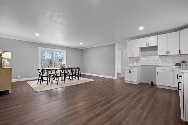 dining room featuring baseboards, ornamental molding, recessed lighting, and dark wood-style floors