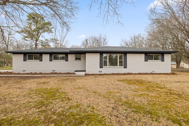 single story home featuring crawl space, brick siding, a front lawn, and roof with shingles