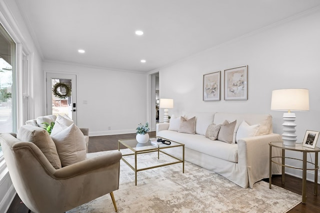 living area with ornamental molding, wood finished floors, recessed lighting, and baseboards