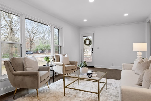 living area with crown molding, dark wood finished floors, recessed lighting, and baseboards