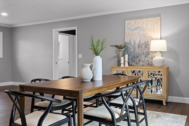 dining room with baseboards, dark wood-style floors, crown molding, and recessed lighting