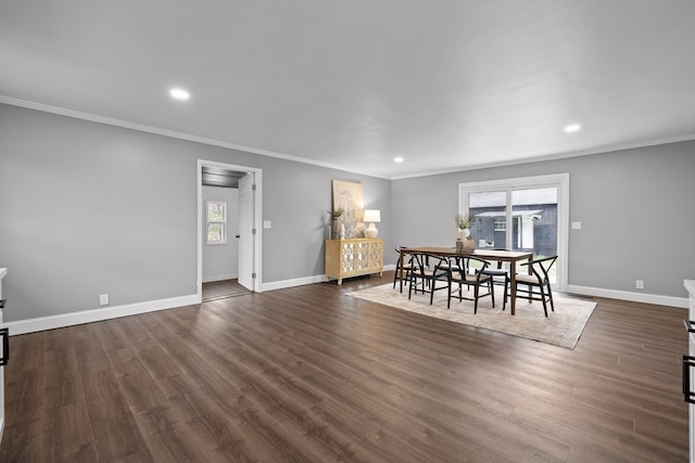 dining area featuring healthy amount of natural light, baseboards, crown molding, recessed lighting, and dark wood-type flooring