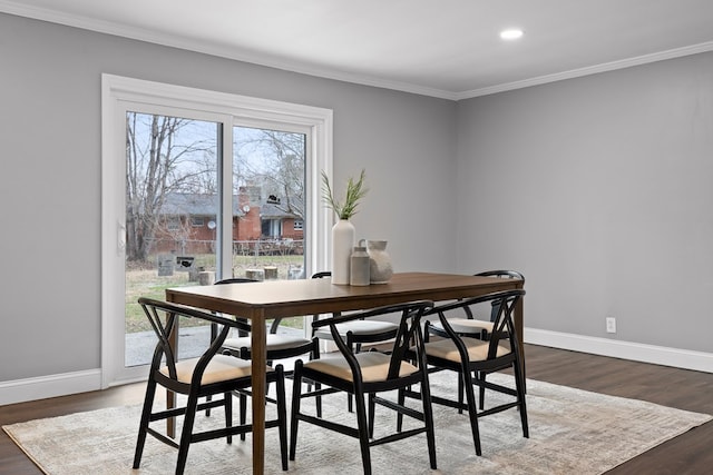 dining area featuring ornamental molding, baseboards, dark wood-style floors, and recessed lighting
