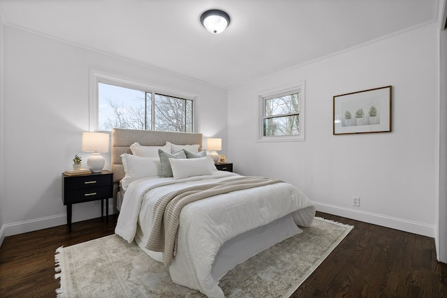 bedroom with baseboards, crown molding, and dark wood-type flooring