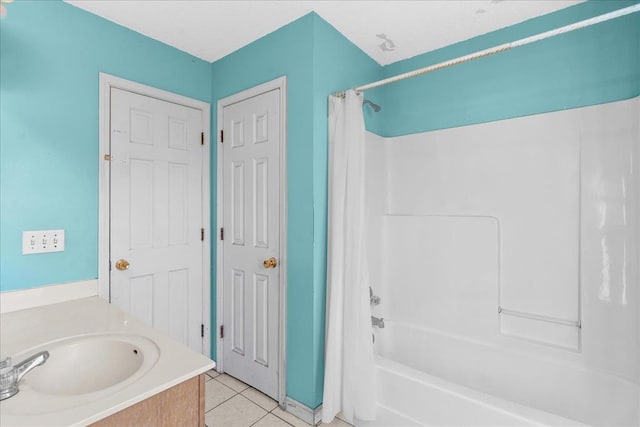 bathroom with tile patterned flooring, vanity, and shower / bath combination with curtain