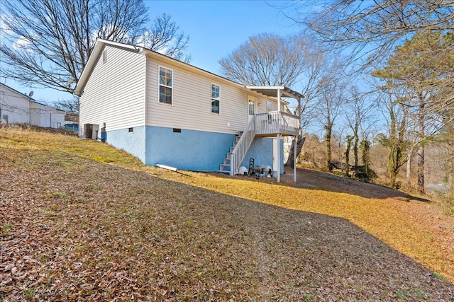 view of side of property with a deck