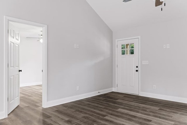 foyer with dark hardwood / wood-style flooring, vaulted ceiling, and ceiling fan