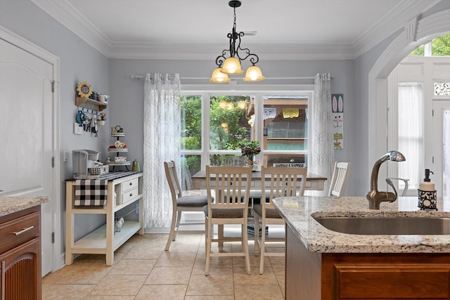 604 Lenna Ln, Dalton, GA 30720 - dining area with light tile patterned floors, crown molding, arched walkways, and a chandelier