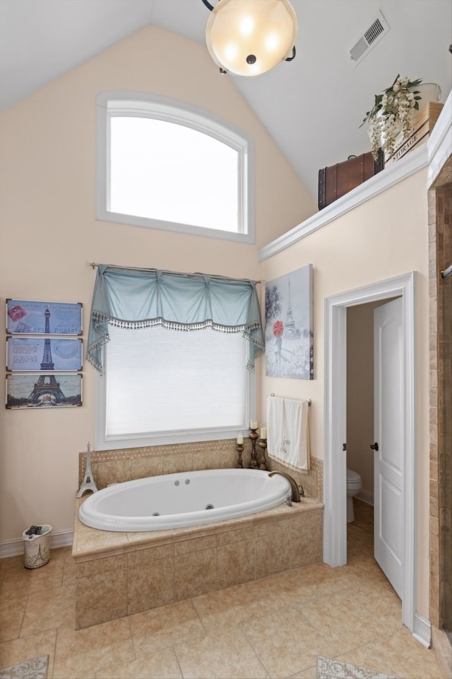 604 Lenna Ln, Dalton, GA 30720 - bathroom with a whirlpool tub, toilet, tile patterned floors, high vaulted ceiling, and a tile shower