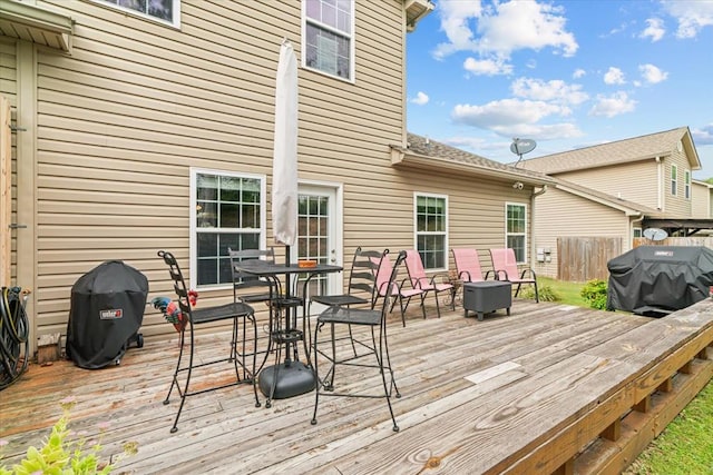 wooden deck featuring area for grilling