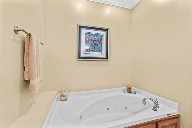 bathroom with crown molding and a tub to relax in