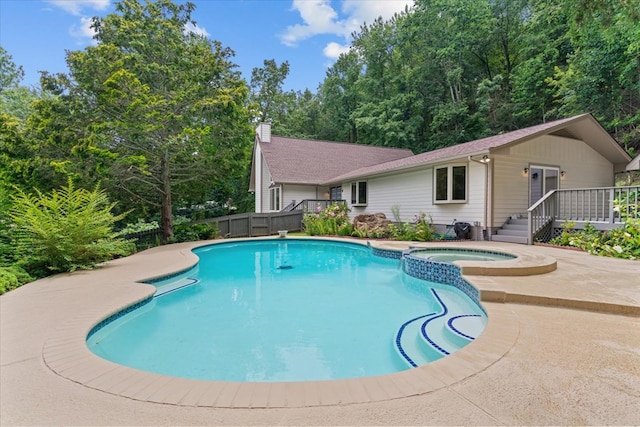 2219 Rocky Face Cir, Dalton, GA 30740 - view of pool featuring a pool with connected hot tub, a wooden deck, and a patio