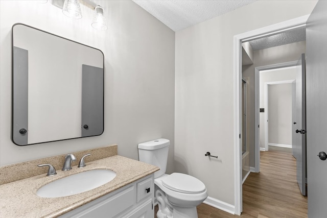 2219 Rocky Face Cir, Dalton, GA 30740 - full bathroom with a shower with shower door, wood finished floors, vanity, and a textured ceiling