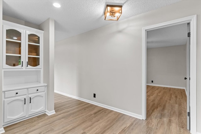 2219 Rocky Face Cir, Dalton, GA 30740 - unfurnished dining area with light wood finished floors, a textured ceiling, and recessed lighting