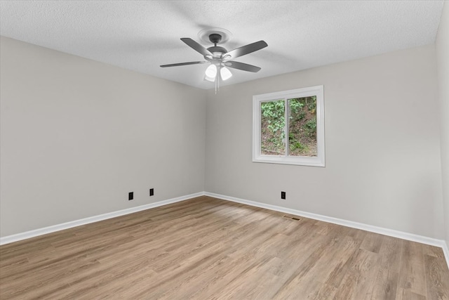 2219 Rocky Face Cir, Dalton, GA 30740 - unfurnished room with light wood finished floors, a textured ceiling, and a ceiling fan