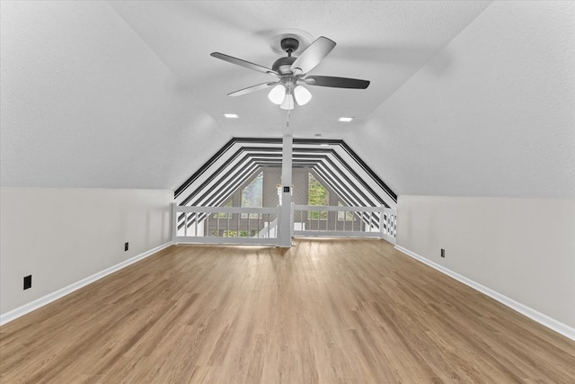 2219 Rocky Face Cir, Dalton, GA 30740 - additional living space with ceiling fan, lofted ceiling, and wood finished floors