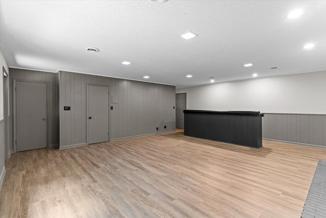 2219 Rocky Face Cir, Dalton, GA 30740 - basement featuring light wood-type flooring, a textured ceiling, and recessed lighting