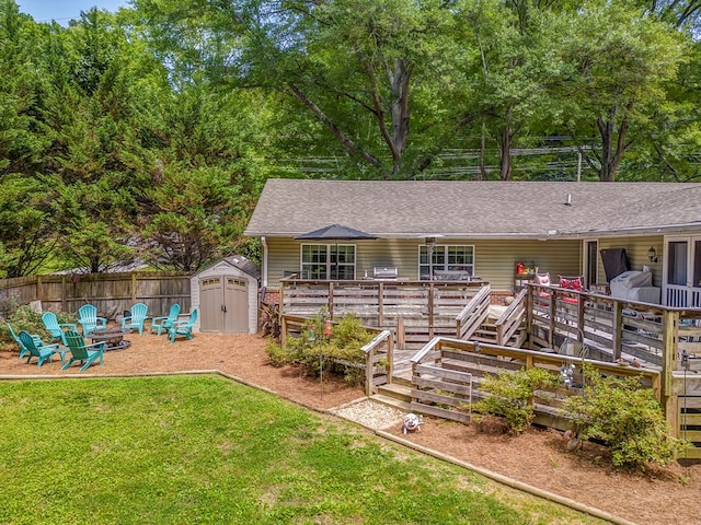 201 Tibbs Rd, Dalton, GA 30720 - rear view of property featuring an outdoor fire pit, a deck, and roof with shingles