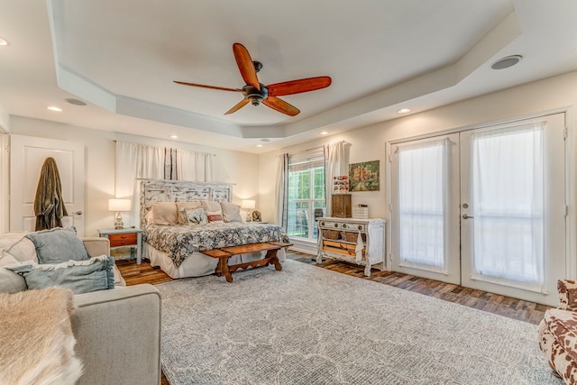 201 Tibbs Rd, Dalton, GA 30720 - bedroom featuring a tray ceiling, wood finished floors, french doors, access to outside, and recessed lighting