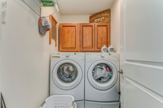 201 Tibbs Rd, Dalton, GA 30720 - washroom with cabinet space and separate washer and dryer