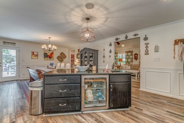 201 Tibbs Rd, Dalton, GA 30720 - bar area featuring a chandelier, wine cooler, a wainscoted wall, ornamental molding, and plenty of natural light