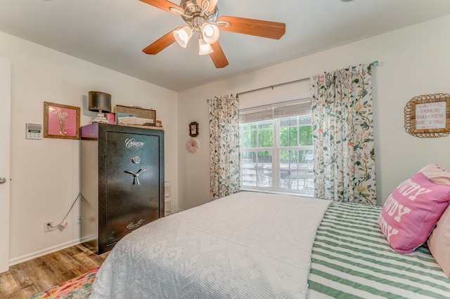 201 Tibbs Rd, Dalton, GA 30720 - bedroom featuring wood finished floors, a ceiling fan, and baseboards