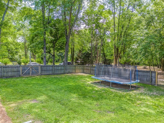 201 Tibbs Rd, Dalton, GA 30720 - view of yard featuring a trampoline and a gate