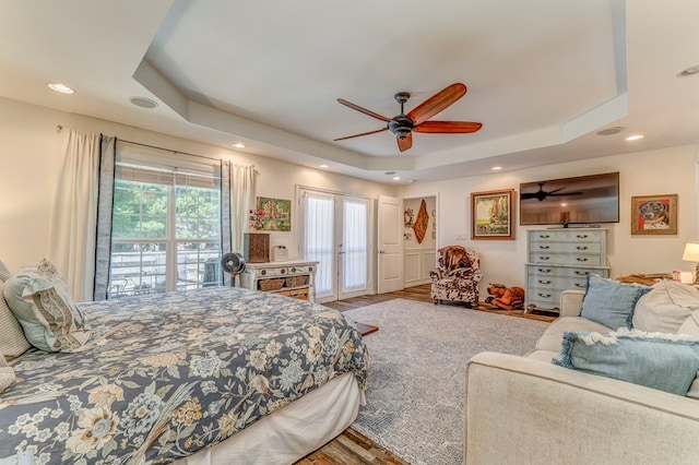 201 Tibbs Rd, Dalton, GA 30720 - bedroom with a tray ceiling, wood finished floors, access to outside, recessed lighting, and a ceiling fan