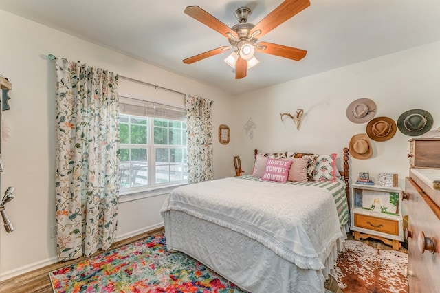 201 Tibbs Rd, Dalton, GA 30720 - bedroom with wood finished floors, baseboards, and ceiling fan