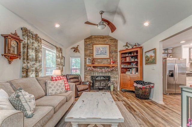 201 Tibbs Rd, Dalton, GA 30720 - living area featuring a ceiling fan, light wood-type flooring, vaulted ceiling, a stone fireplace, and recessed lighting