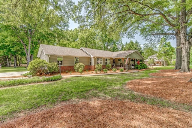 201 Tibbs Rd, Dalton, GA 30720 - ranch-style home with covered porch, a front lawn, and brick siding