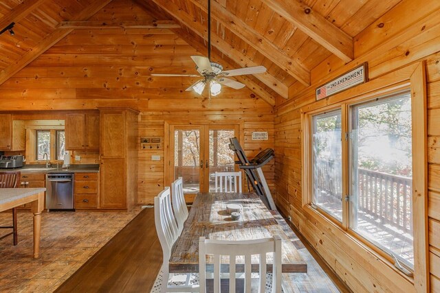 bedroom featuring lofted ceiling, dark hardwood / wood-style floors, ceiling fan, and wood walls