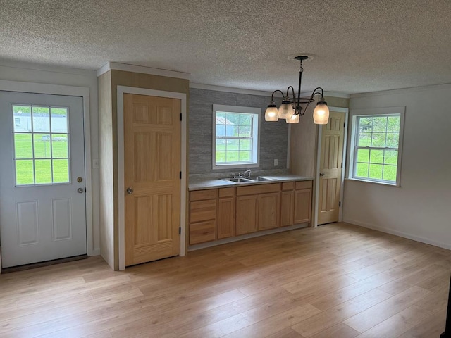 104 Riverview Dr, Dalton, GA 30721 - kitchen with a chandelier, light wood-style floors, a sink, a textured ceiling, and baseboards