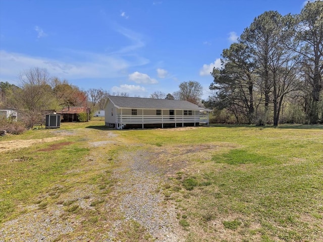 104 Riverview Dr, Dalton, GA 30721 - rear view of house featuring a lawn and central AC