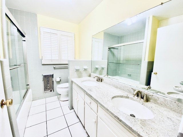 503 Williamsburg Dr, Dalton, GA 30720 - full bathroom with tile patterned flooring, toilet, tile walls, and a sink