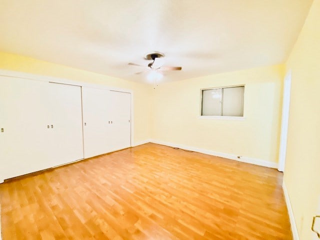 503 Williamsburg Dr, Dalton, GA 30720 - unfurnished bedroom featuring baseboards, ceiling fan, and light wood finished floors