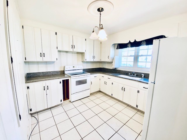 503 Williamsburg Dr, Dalton, GA 30720 - kitchen featuring white cabinetry, white appliances, dark countertops, and a sink