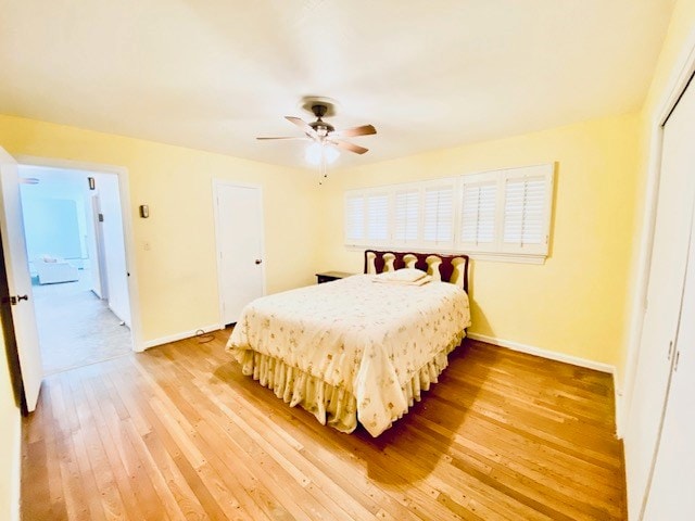 503 Williamsburg Dr, Dalton, GA 30720 - bedroom with light wood-type flooring, baseboards, a closet, and ceiling fan
