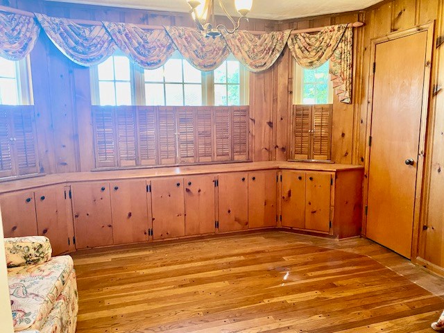503 Williamsburg Dr, Dalton, GA 30720 - interior space with wooden walls and light wood finished floors